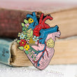 Load image into Gallery viewer, heart anatomy pin with flowers by codex anatomicus
