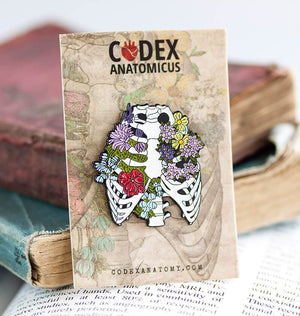 rib cage with flowers enamel pin
